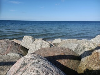 rocks on the beach. big stones on the seashore. stone shore. beautiful view of the sea