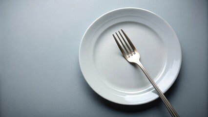 A solitary fork lies on an untouched plate, the tines pointing towards a nearly empty space, fork, emptiness