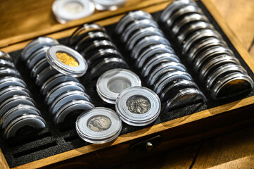 Numismatics, storage of ancient gold and silver coins in plastic boxes