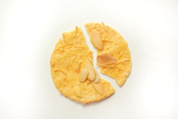 Almond crispy cookies with grated cheese, thin texture, isolated on white background, cracked