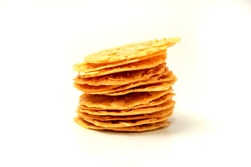 Almond crispy cookies with grated cheese, thin texture, isolated on white background, stacked