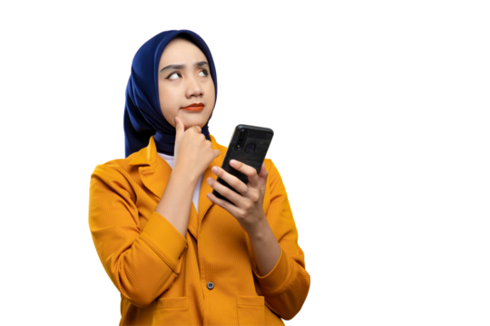 Pensive young Asian woman holding mobile phone, touching her chin, looking at copy space, thinking about online offers isolated on transparent background