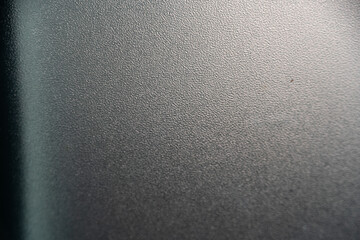 Close-up texture of a gray metallic surface with a smooth finish.