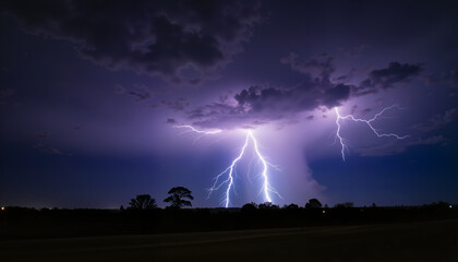 Dramatic lightning strikes in a stormy sky over a dark landscape  