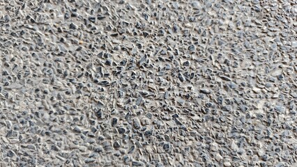 Detailed Close-Up of Textured Concrete Surface with Unique Natural Patterns