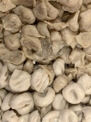 Fresh Homemade Dumplings Prepared for Cooking in a Rustic Kitchen Setting