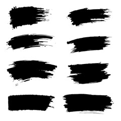 Paint brush strips with rough edges and fading marks on white background. Black smeared streaks with natural ink texture and vertical movement. Grunge elements