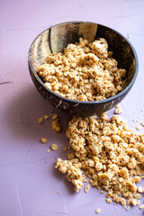 Close-up of coconut bowl with granola and oats