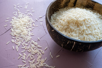 white rice in a coconut bowl close up
