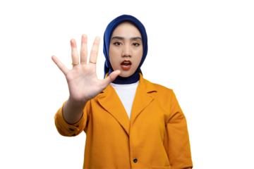 Frustrated young Asian woman making stop gesture with outstretched hand isolated on transparent background