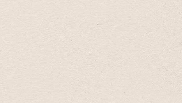 Cream concrete wall texture background. Uneven render stucco white painted concrete wall texture background. Rough and grunge wall in the sun.