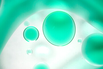 Colorful Bubbles and Liquid in Abstract Green Background