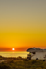 Fototapeta premium Caravan on sea at sunrise.