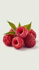 Close-up of fresh raspberries with green leaves
