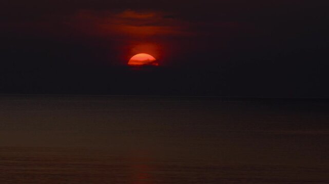 Beautiful sea view with a breathtaking sunset, showcasing heavenly clouds and a serene horizon. Perfect for nature, travel, and tropical themes. Captivating scene of Thailands tranquil beauty