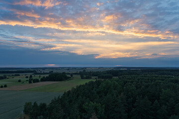 The sky is a beautiful orange and pink color