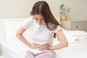 Flatulence ulcer, asian young woman, girl hands in belly, stomach pain from food poisoning,...