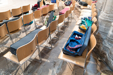 Opened musical string instrument cases seen on chairs within a famous English cathedral during a...