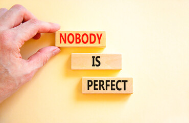 Nobody is perfect symbol. Concept words Nobody is perfect on beautiful wooden block. Beautiful white background. Business motivational lifestyle and nobody is perfect concept. Copy space.