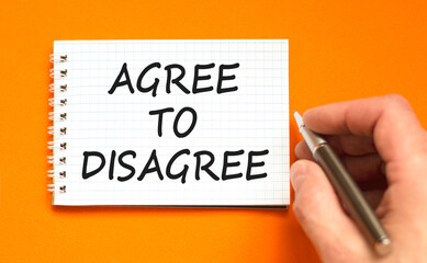 Agree to disagree symbol. Concept words Agree to disagree on beautiful white note. Beautiful orange...
