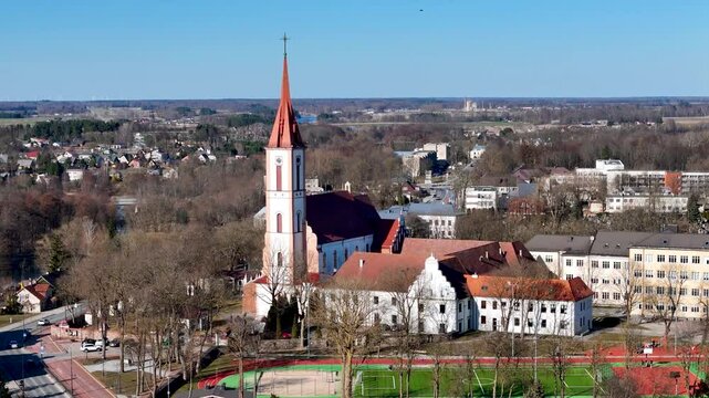 Church of the Annunciation of the Blessed Virgin Mary and Order of Friars Annunciation Monastery in Kretinga, Lithuania. Aerial drone 4K video footage