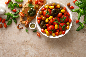 Fresh ripe cherry tomatoes and large red tomatoes, top view