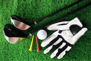 Golf Equipment on Green Turf with Tees, Ball, and Glove