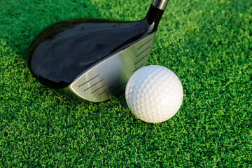 Close-Up of Golf Club and White Golf Ball on Green Grass Surface