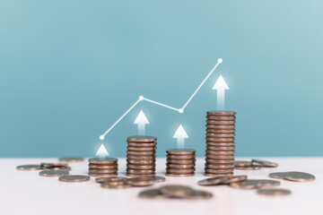 Invest, interest rates, dividends,deposits, business, finance and Investment. Upward arrows with increasing piles of coins indicating investment growth on blue background