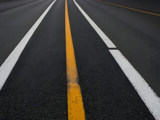 Road Markings and Pathways: An image of a road, highlighting its distinct markings that guide direction for road user and symbolizing routes and pathways for travel.