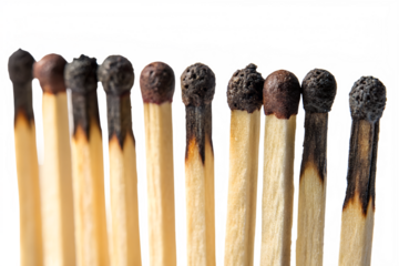 Progression of burnt matches illustrating burnout concept with black background and creative lighting