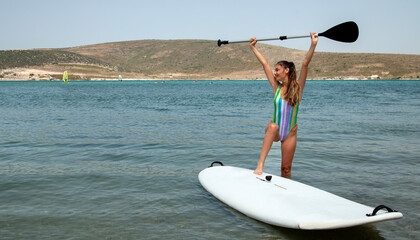 young man surfing on the beach