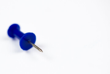 Close-up of a colored pin on a white background, isolate with space for text