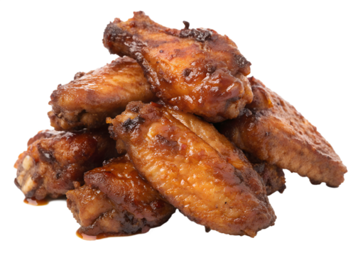 Appetizing chicken wings with glaze served on a black background ready to eat