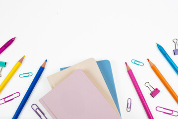 A Collection of Colorful Stationery Items Arranged on a White Background for Creative Projects