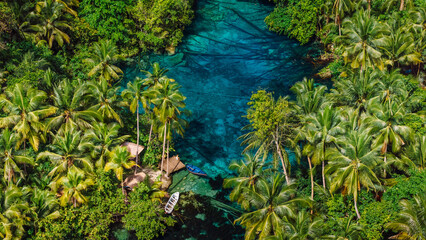 Transparent lake with crystal blue water in Indonesia. Drone view