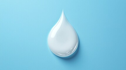 Fototapeta premium A drop of liquid is on a blue surface
