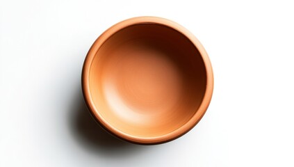 Top-view of empty terracotta bowl on white background.