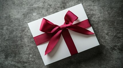 Elegant Gift Box with Crimson Bow with Dark Background.