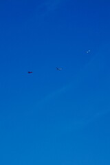 motorized hang glider cross in prospectical plane an aerial glider towed by a motorized aircraft in a sunny summer morning