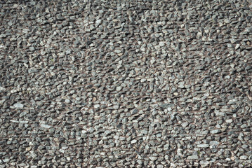 Grey gravel laid on the site, background.