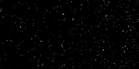 Isolated natural white snow texture effect on black night background. Abstract background. Monochrome texture.