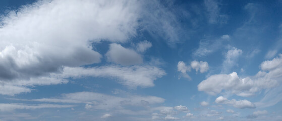 Sky panorama, the sky is blue, many clouds. clouds are white and fluffy.  sky is very clear and bright
