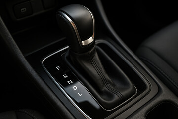 Close-up of automatic transmission gear lever (PRNDL) in a modern vehicle. Sleek, functional interior element for driving mode control and comfort.