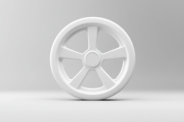Fototapeta premium Monochrome image of a five spoke wheel on a light surface