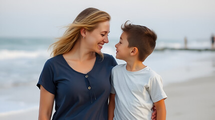 Smiling mother and son rubbing noses while standing on beach