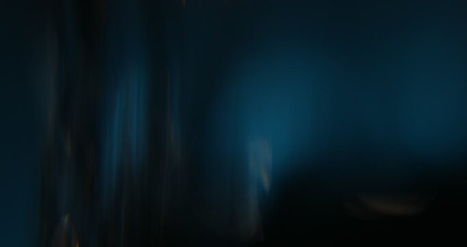 Abstract light leaks on black background with copy space. Studio lens flare bokeh effect. 4k video