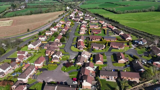 Drone aerial video of Residential homes town houses bungalows semidetached housing in Templepatrick Co Antrim Northern Ireland