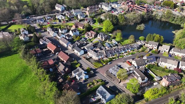 Drone aerial video of Residential homes town houses bungalows semidetached housing in Templepatrick Co Antrim Northern Ireland
