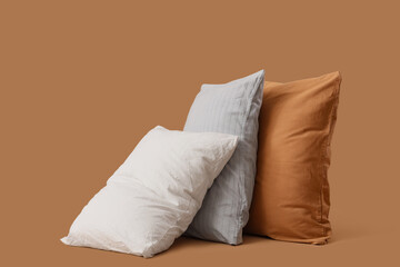 Different pillows on beige background